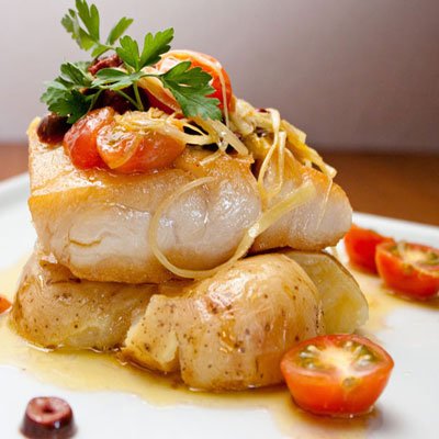 baked fish with potatoes and cherry tomatoes